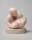 Sculpture depicting a baby suckling at an abstracted form of its mother